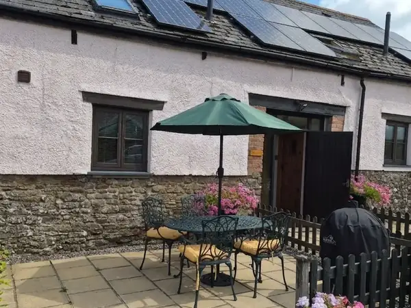 Outdoor seating at Bridge Cottage