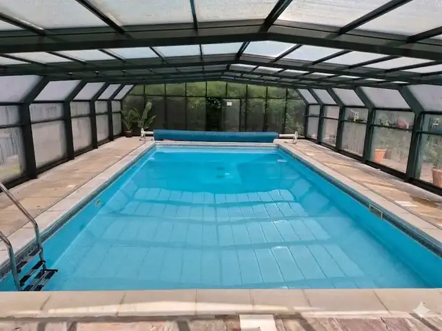 Heated outdoor swimming pool at Bridge Farm Country Stays