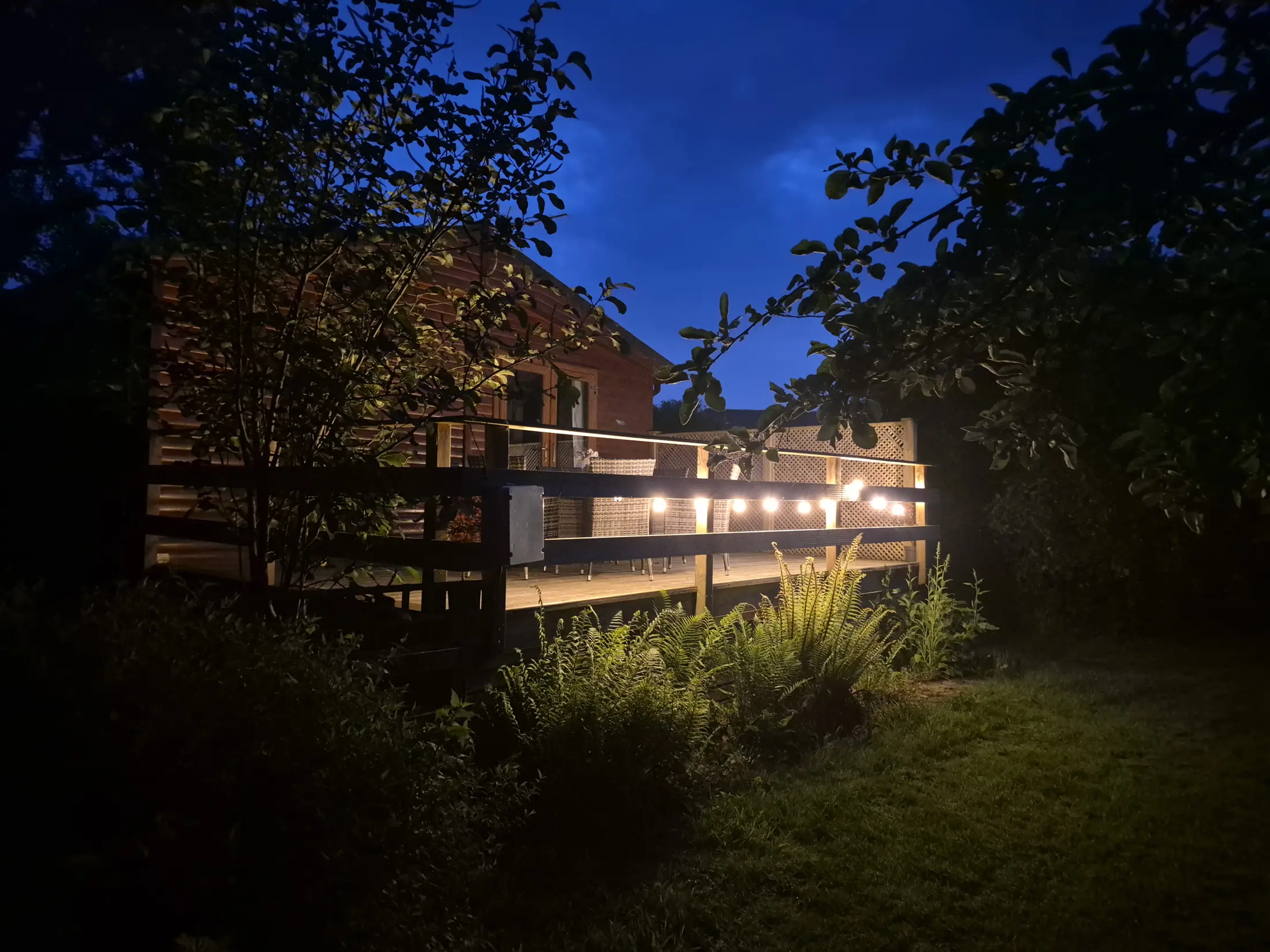 Torridge Lodge illuminated at night